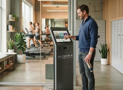 A resident using the Axentra Health wellness station beside the package lockers and fitness center of an apartment community